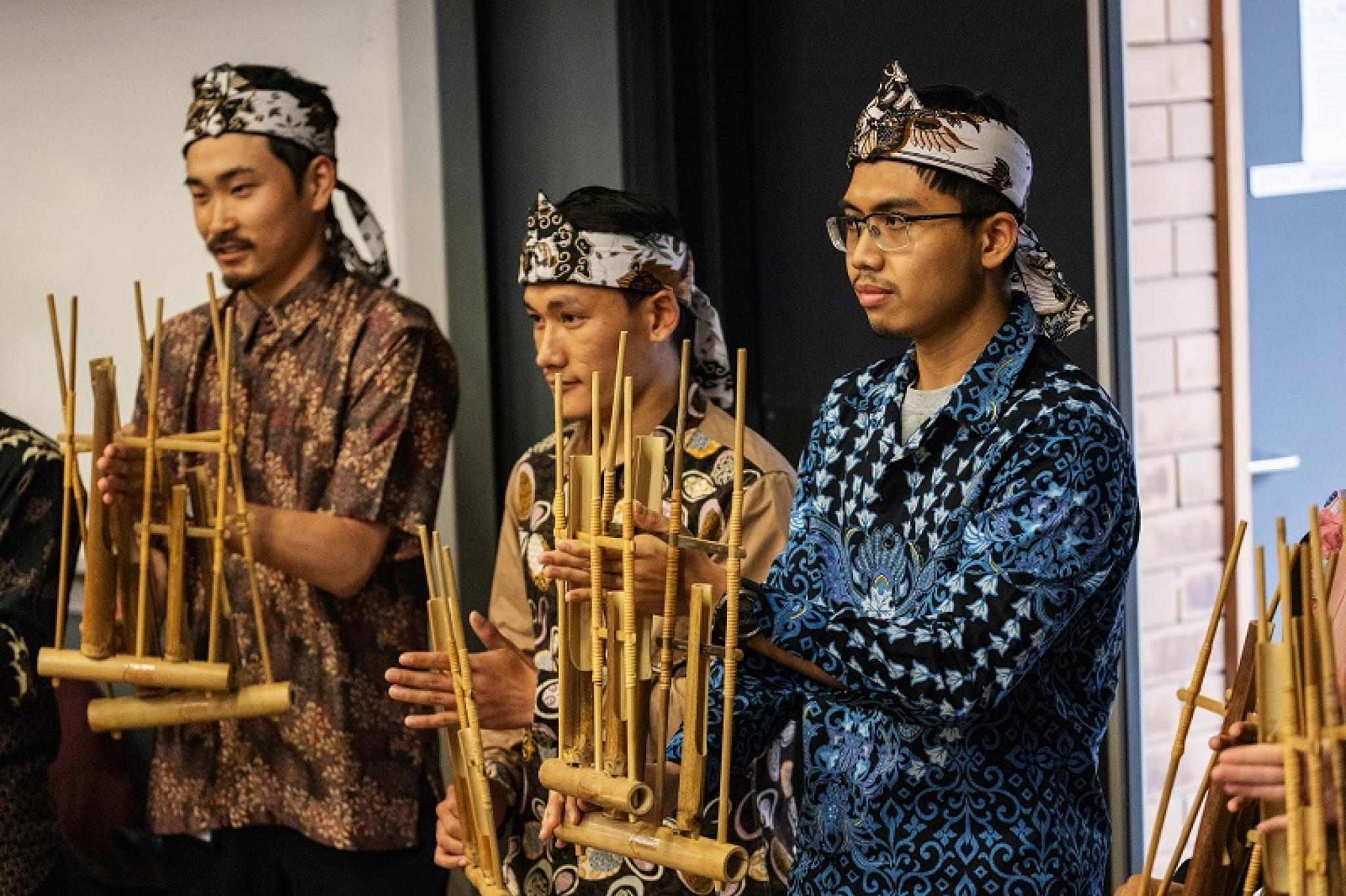 A Japanese (left) and a Nepalese (middle) add to the cultural mix of the event as members of the ANUISA Angklung Group