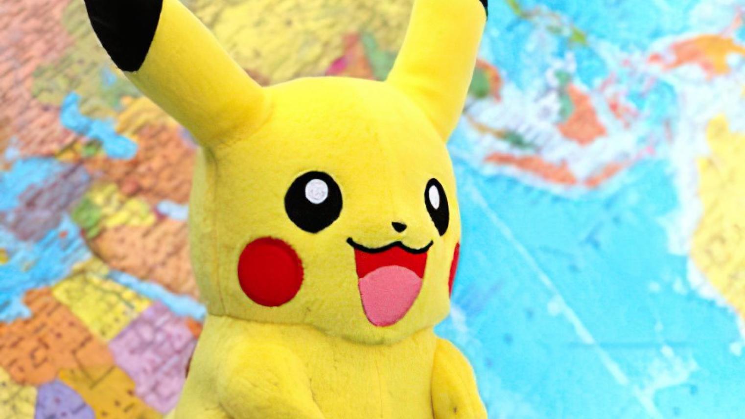Pikachu in front of a world map
