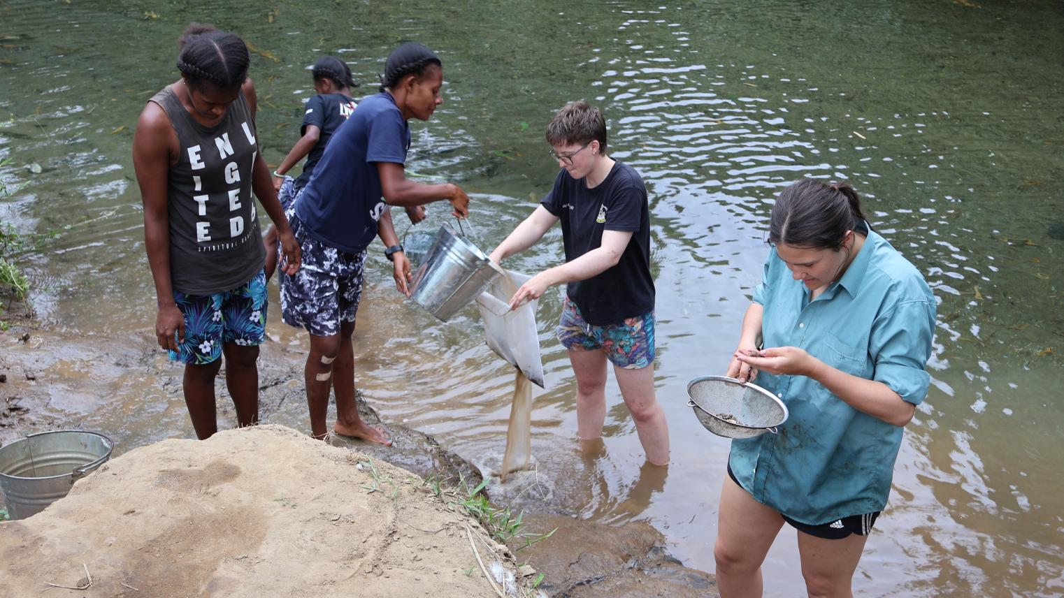 Flotation underway in the Pangpang river. L-R: Locals, Emma Umau, Valetine Gracien, Rose Boblong and ANU students, Ellie Griffin and Natasha Lyall